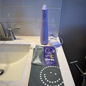 Purple Burst Water Flosser with 2 new tips